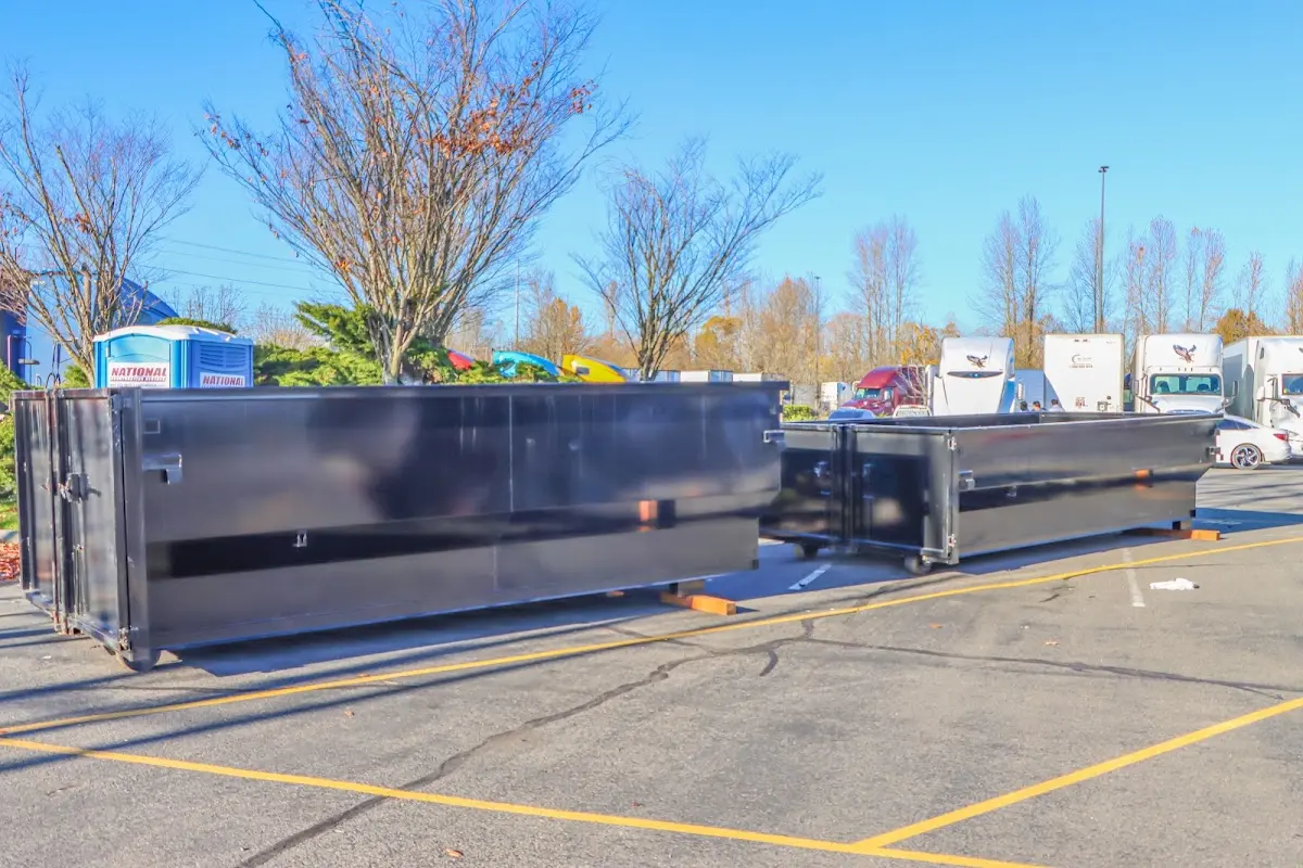 Professional dumpster rental service with roll-off container on residential driveway in North Union
